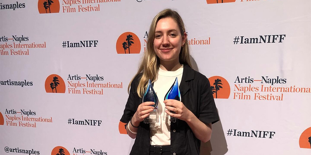 Isabel Hagen holding "Jury Award for Best Narrative Feature" and "Focus on the Arts" Awards